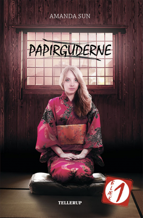 A blond girl in a kimono kneeling in front of a rice paper window